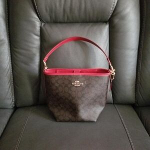 Coach Brown Signature Canvas Bucket Bag with Red Trim